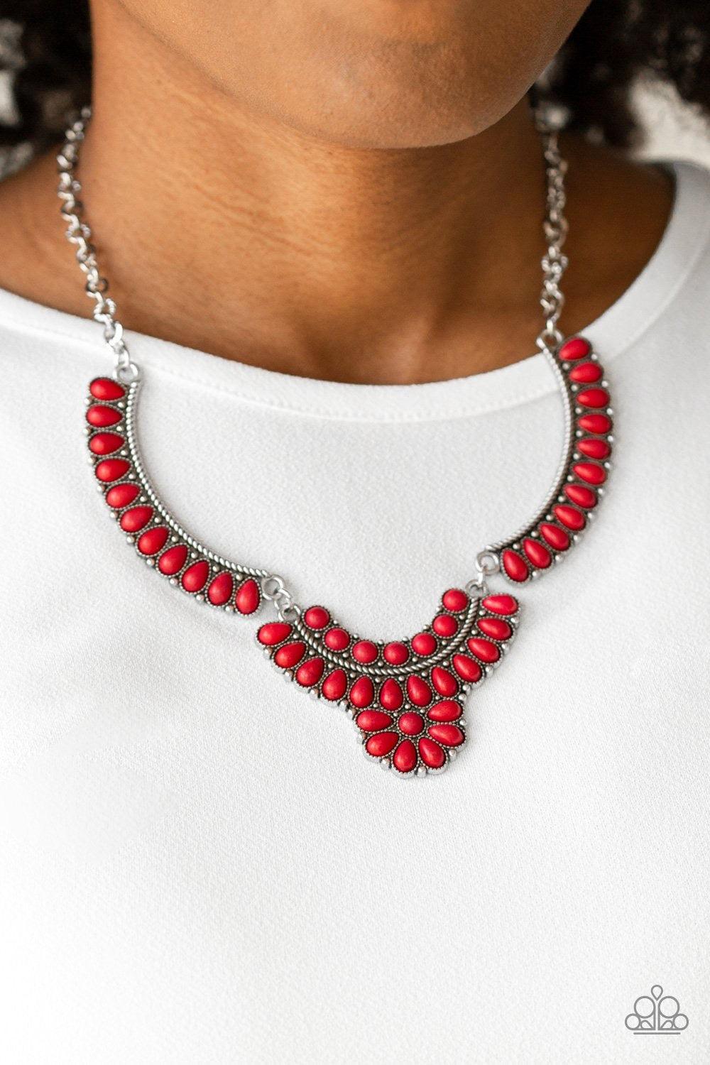 Paparazzi Accessories Omega Oasis - Red Featuring round and teardrop shapes, a collection of tranquil red stone beads are pressed into interconnected silver plates, creating a fiery floral inspired statement piece below the collar. Features an adjustable