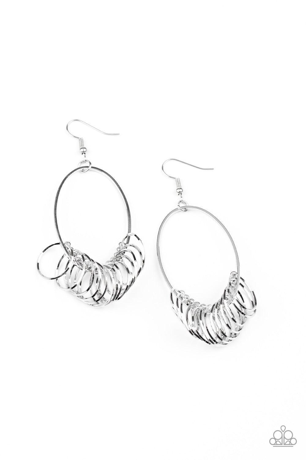 Paparazzi Accessories Halo Effect - Silver A collection of dainty silver rings are secured in place along the bottom of a silver oval frame, creating a dizzying fringe. Earring attaches to a standard fishhook fitting. Sold as one pair of earrings. Jewelry