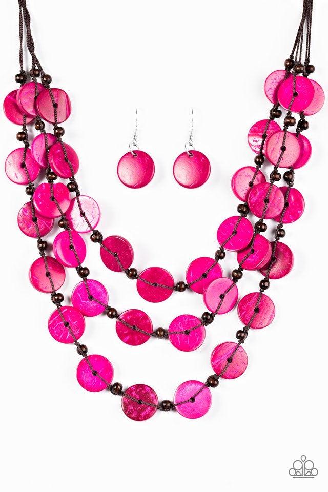Paparazzi Accessories Tiki Tango - Pink Tinted in pink finishes, shiny wooden discs trickle along shiny brown cording, creating three colorful layers below the collar. Features a button-loop closure. Sold as one individual necklace. Includes one pair of m