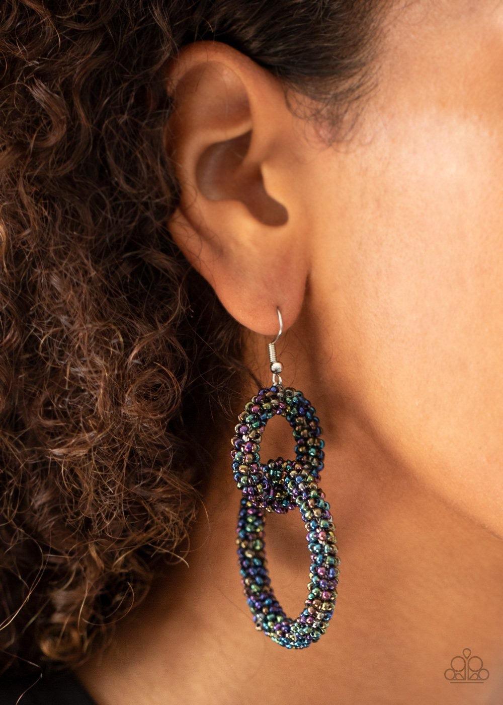 Paparazzi Accessories Luck BEAD a Lady - Multi A dainty collection of iridescent oil spill seed beads adorns two interlocking hoops, creating a colorfully stacked lure. Earring attaches to a standard fishhook fitting. Sold as one pair of earrings. Jewelry