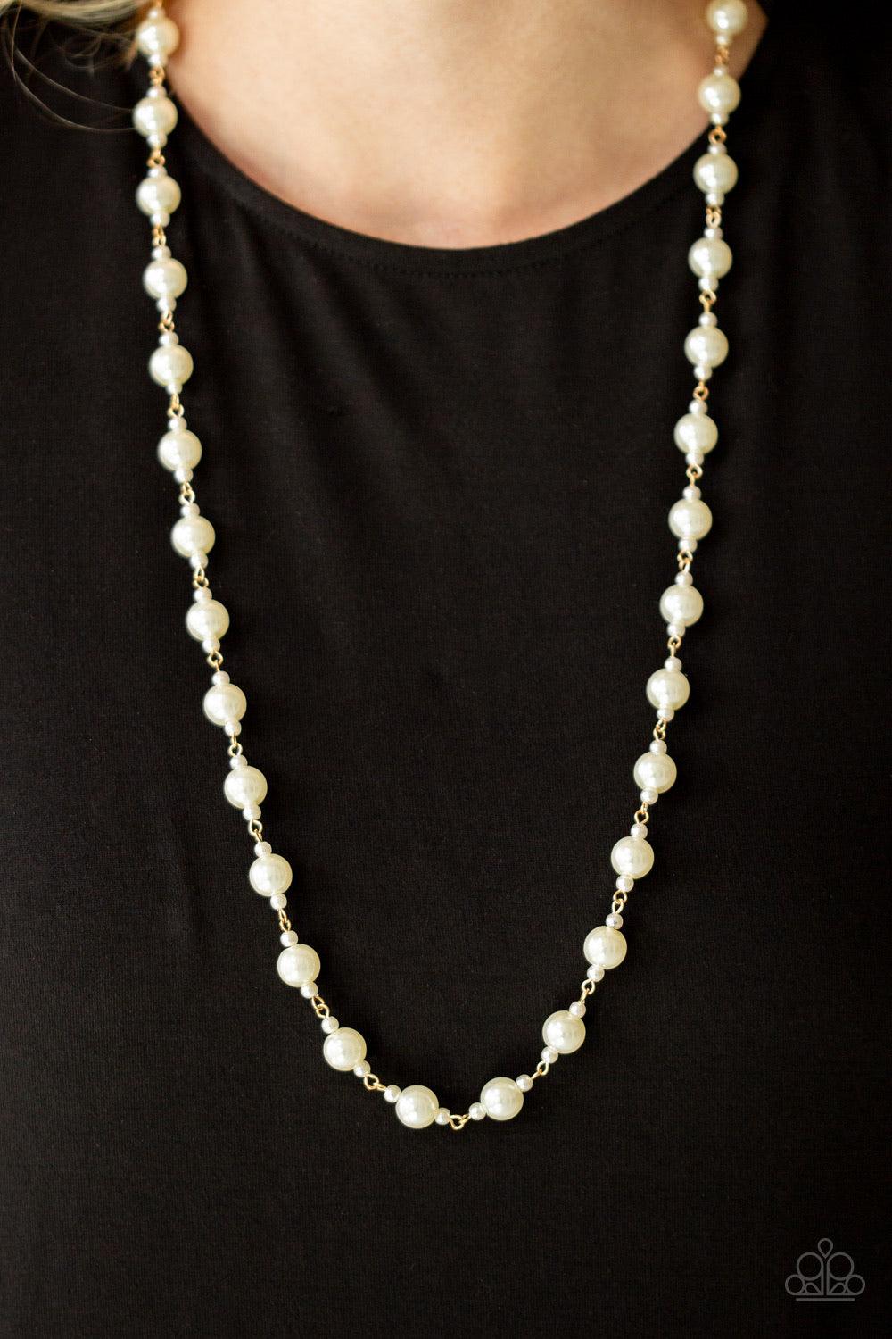 Paparazzi Accessories Behind The Scenes - Gold A collection of dainty and classic white pearls link across the chest in a timeless fashion. Features an adjustable clasp closure. Jewelry
