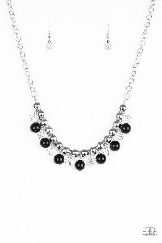 Paparazzi Accessories Power Trip - Black Infused with a bold silver chain, classic silver beads are threaded along a skinny wire below the collar. Polished black and faceted crystal-like beads swing from the bottom of the silver beads, creating a refined