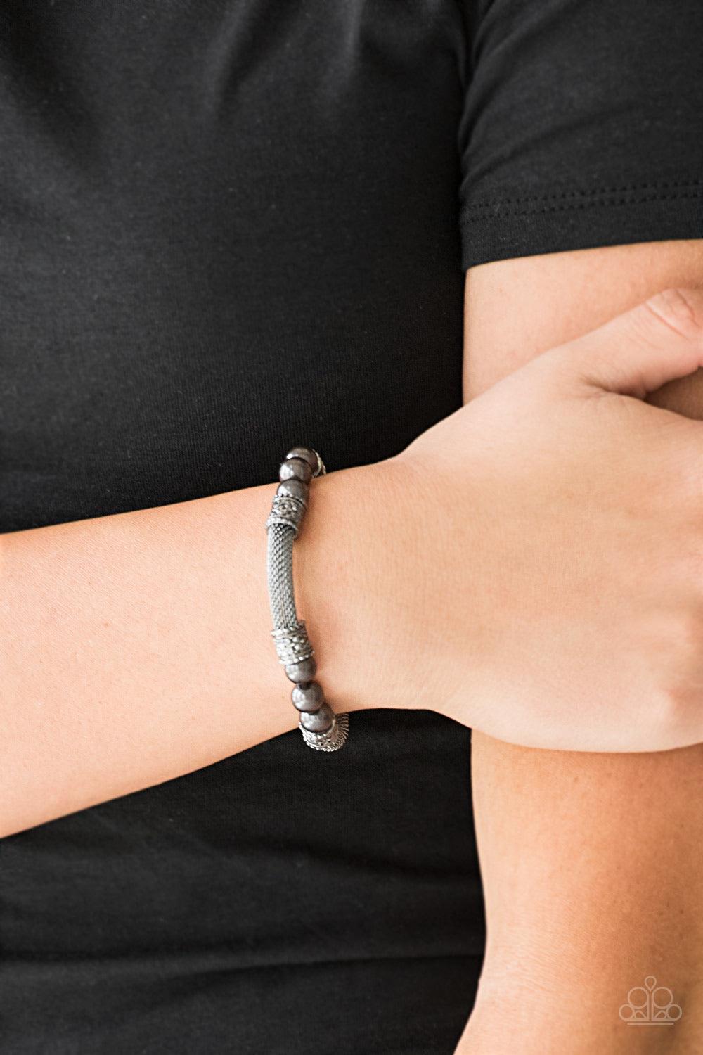 Paparazzi Accessories Talk Some SENSEI - Black Pearly gunmetal beads, ornate gunmetal accents, and sections of gunmetal mesh chain are threaded along a stretchy band around the wrist for a refined flair. Jewelry