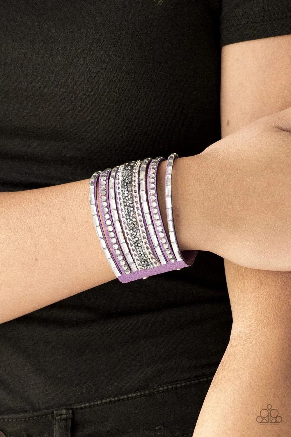 Paparazzi Accessories Rhinestone Rumble - Purple White emerald-cut rhinestones, smoky round rhinestones, and metallic prism-shaped rhinestones are sprinkled along strands of vivacious purple suede. Shimmery silver chain is added to the mix for a sassy ind