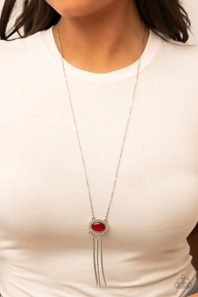 Paparazzi Accessories Happily Ever Ethereal - Red Attached to silver prongs, glassy white rhinestones radiate out from a red cat's eye stone at the bottom of a dainty silver chain. A curtain of shimmery silver chains streams from the bottom of the etherea
