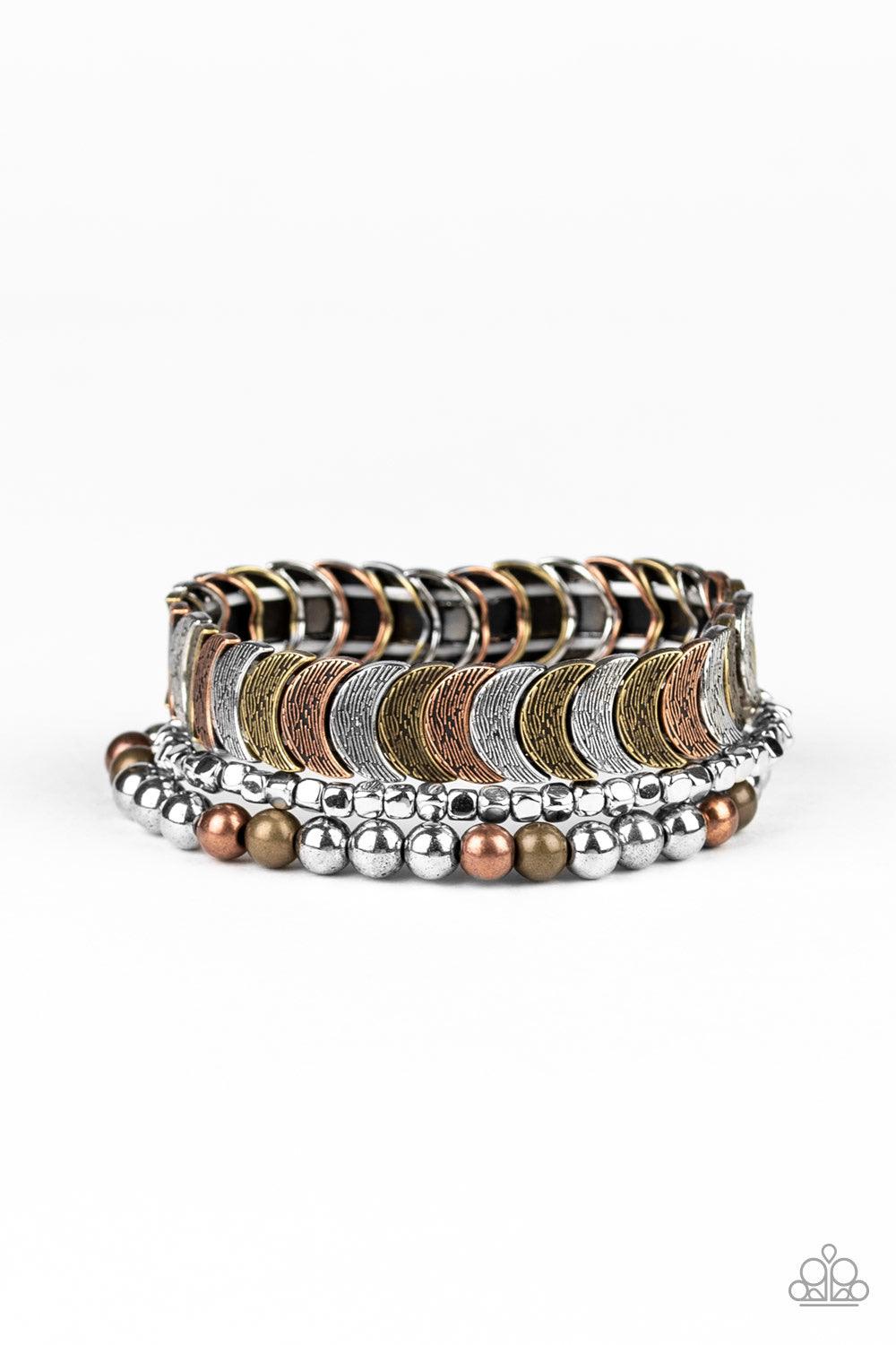 Paparazzi Accessories LAYER It On Me - Multi Featuring round, cube, and half-moon shapes, mismatched brass, copper, and silver beads are threaded along stretchy bands, creating trendy mixed metallic layers around the wr Jewelry