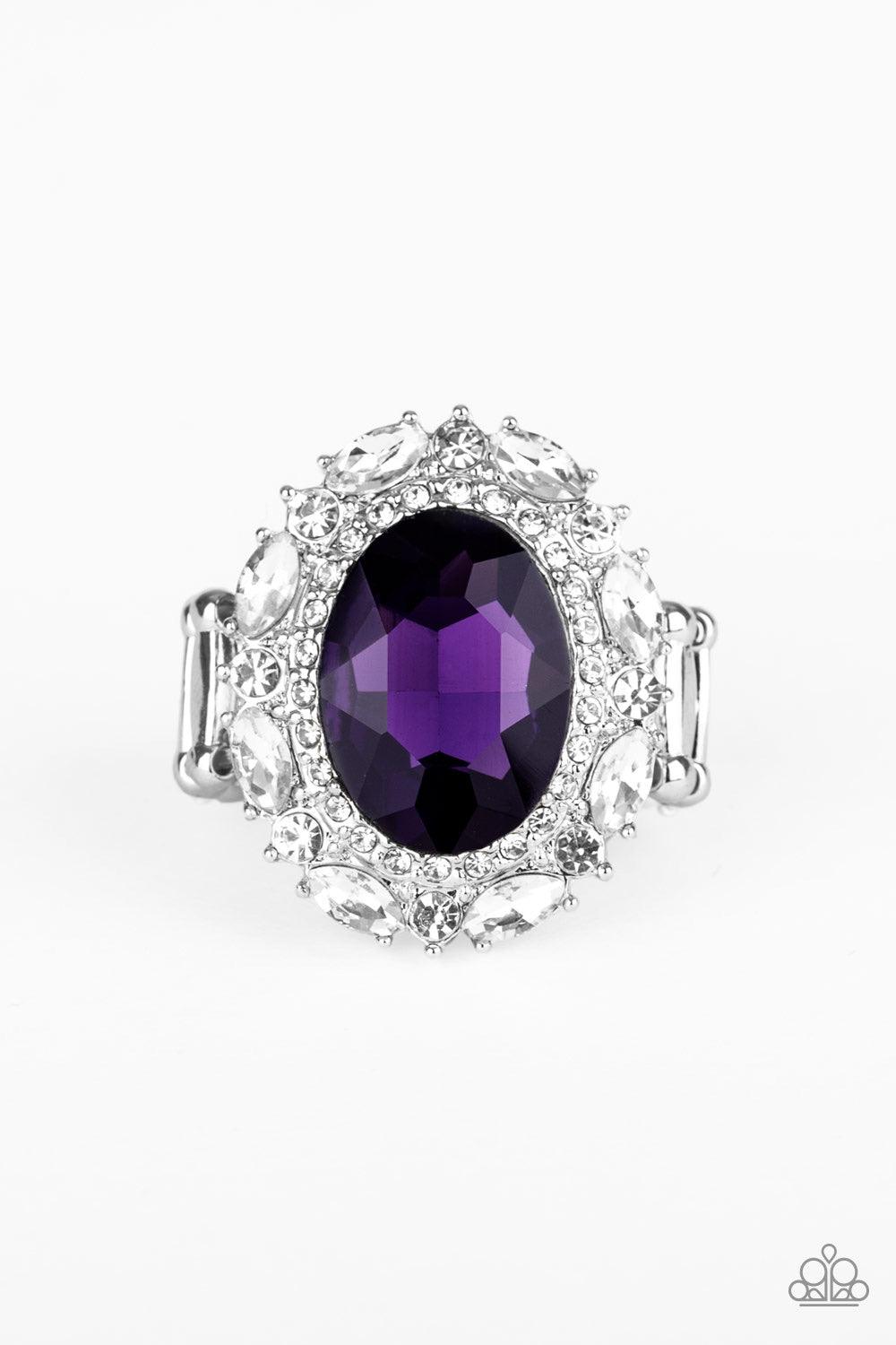 Paparazzi Accessories Show Glam - Purple An oversized oval purple gem is pressed into the center of a round silver frame encrusted in mismatched white rhinestones for a glamorous look. Features a stretchy band for a flexible fit. Jewelry