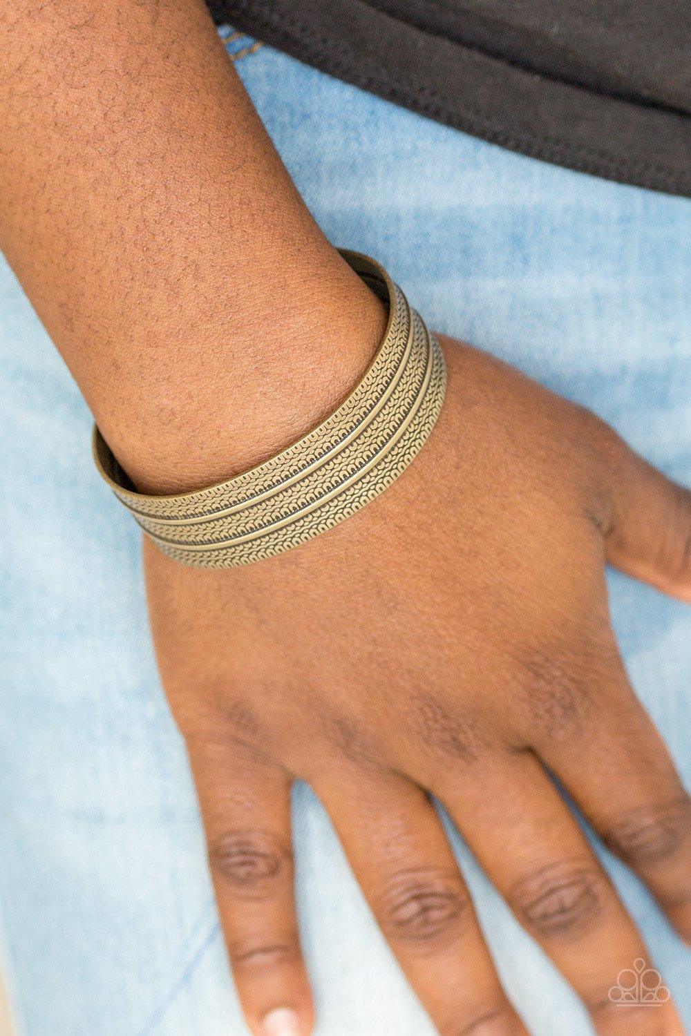 Paparazzi Accessories Absolute Amazon - Brass Stamped in tribal inspired patterns, an antiqued brass cuff wraps around the wrist for an indigenous look. Sold as one individual bracelet. Jewelry