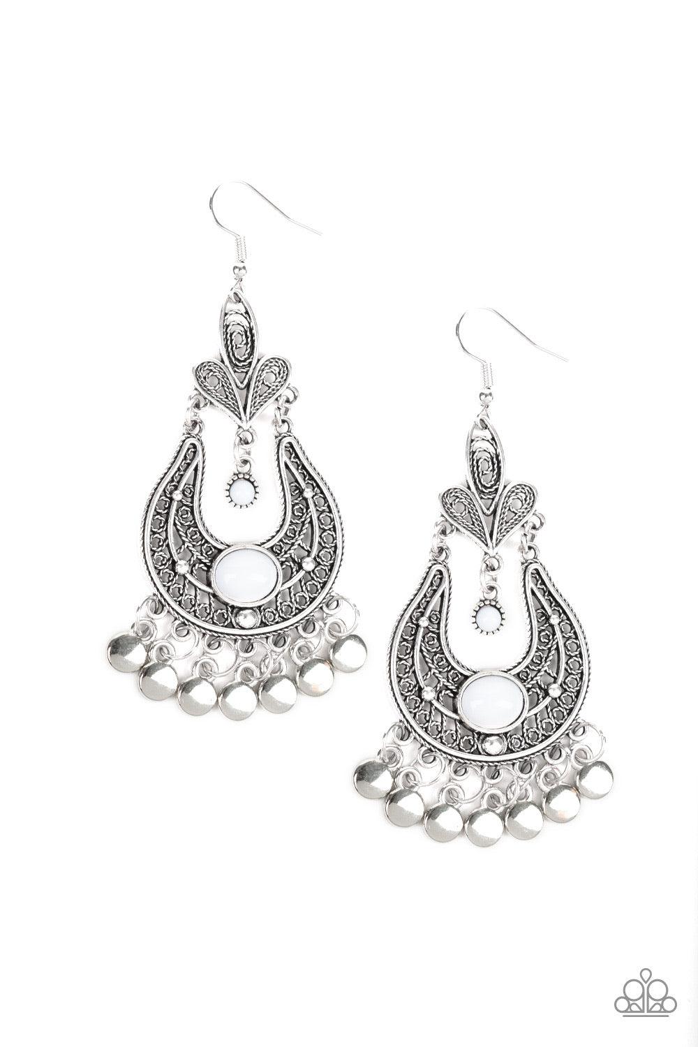 Paparazzi Accessories Fiesta Flair - White Swirling with vine-like filigree, ornate silver frames delicately link into a stacked frame. Infused with shiny white beads, the whimsical frame gives way to a fringe of glistening silver discs for a playful flai