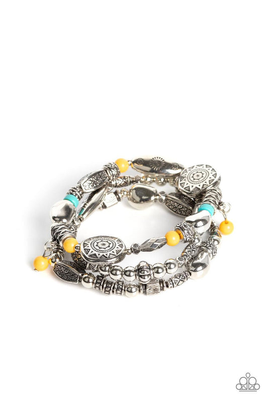 Paparazzi Accessories Western Quest - Yellow Infused with hints of black, Olive Branch, Adobe, and Soybean accents, a mismatched collection of silver beads, textured silver accents, and floral and sunburst embossed beads are threaded along stretchy bands