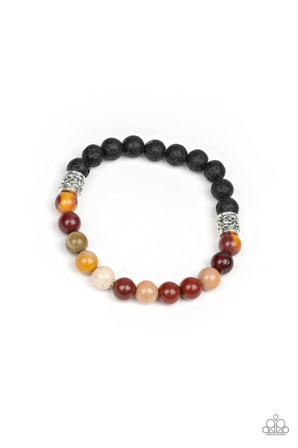 Paparazzi Accessories Take it Easy - Yellow Infused with dainty silver accents, a collection of black lava rock beads and refreshing stone beads are threaded along a stretchy band around the wrist for a seasonal style. Jewelry