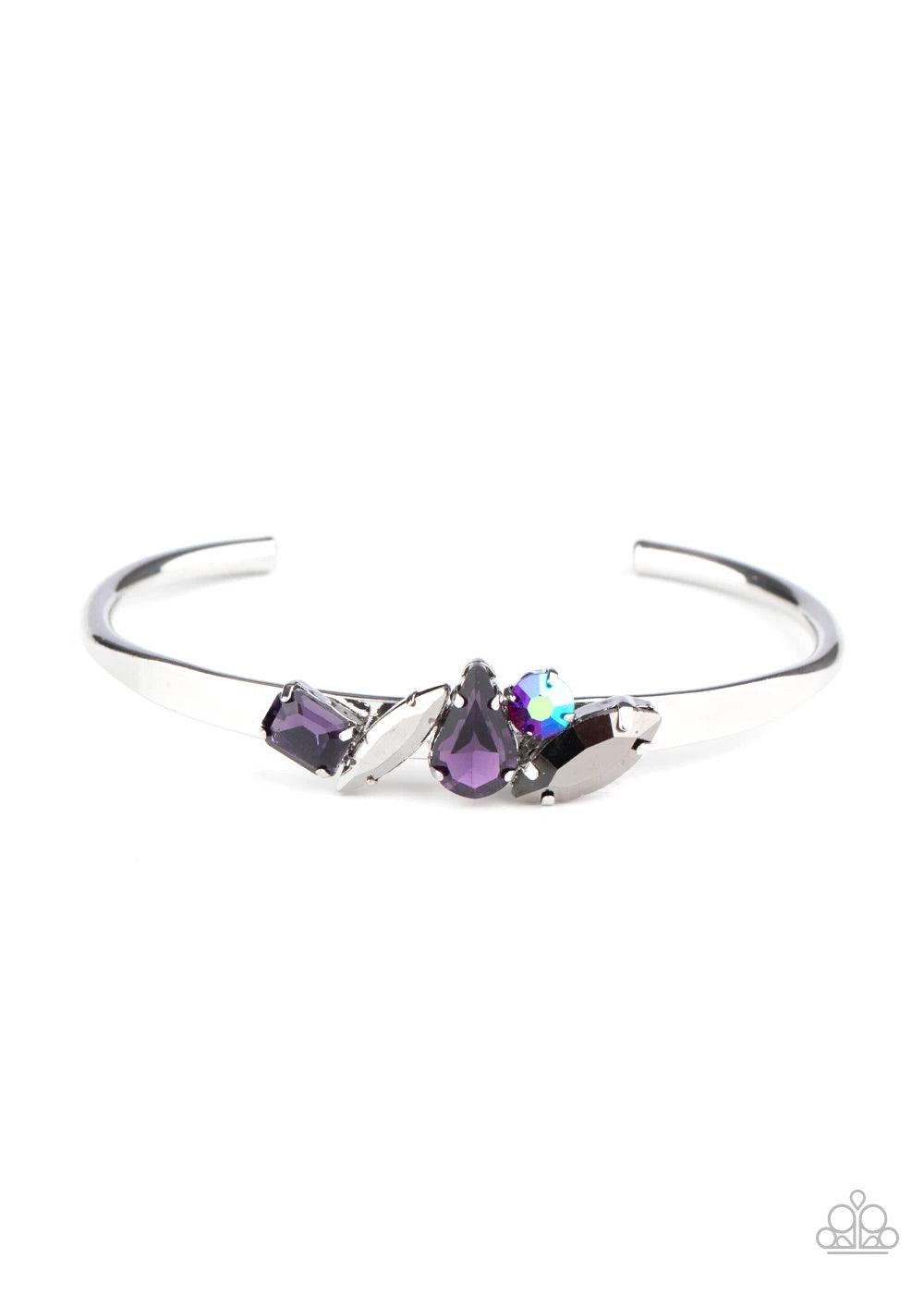 Paparazzi Accessories Gemstone Grotto - Purple Varying in size and cut, an array of purple, hematite, and iridescent gems are encrusted along the top of a dainty silver cuff, creating a sparkling centerpiece. Sold as one individual bracelet. Jewelry
