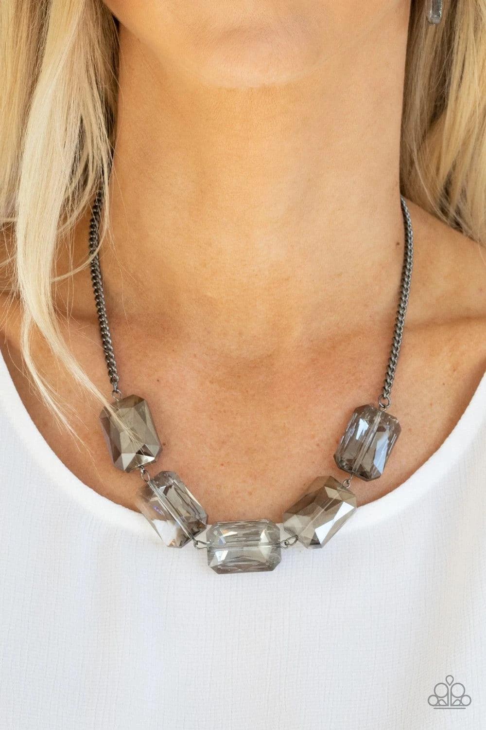 Paparazzi Accessories Heard It On The HEIR-Waves - Black Gorgeously oversized smoky emerald cut gems fabulously link below the collar, creating an iridescently icy statement piece. Features an adjustable clasp closure. Sold as one individual necklace. Inc