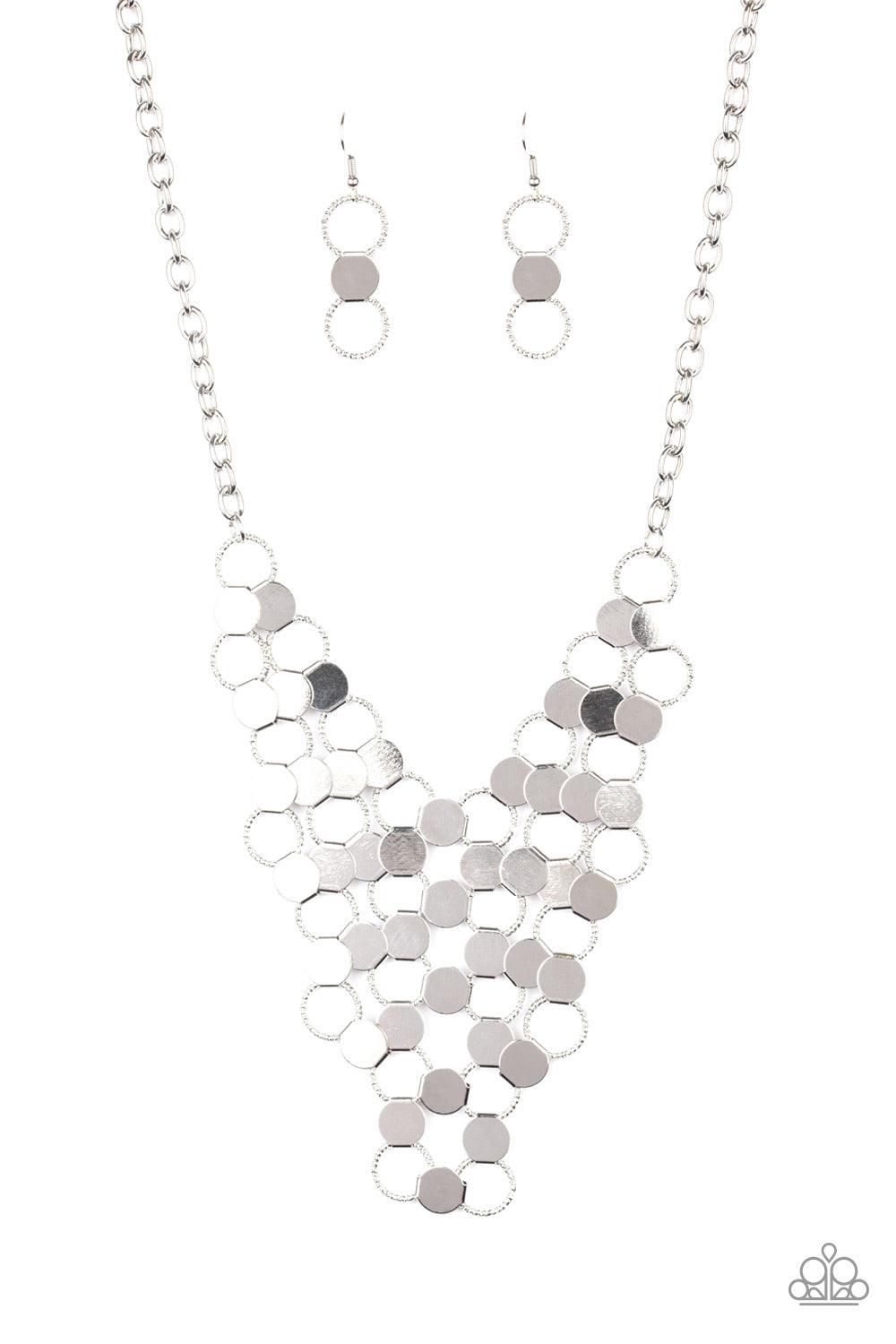 Paparazzi Accessories Net Result - Silver An interlocking net of textured silver rings and reflective silver discs link into a dramatically netted fringe below the collar. Features an adjustable clasp closure. Jewelry