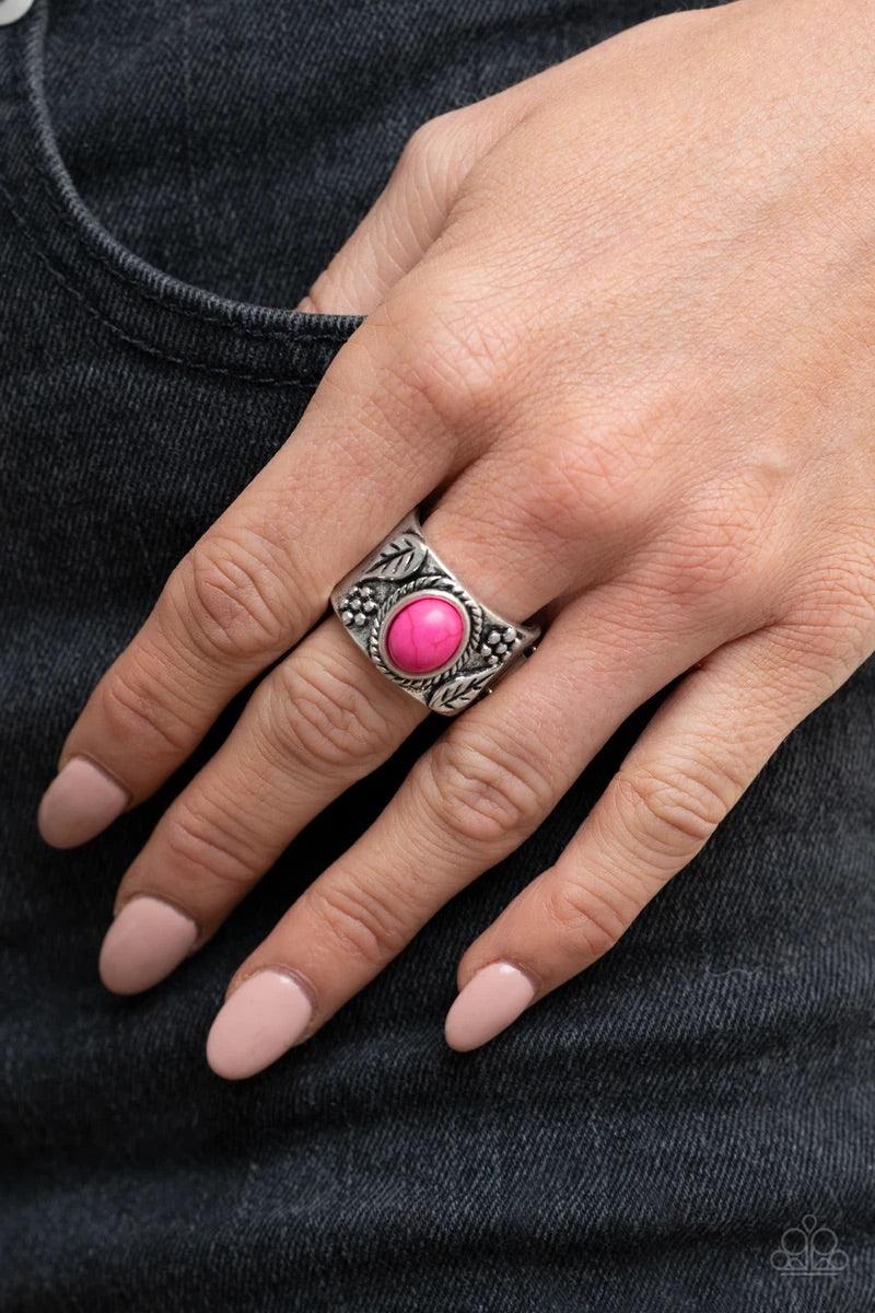 Paparazzi Accessories Free-Spirit med Fields - Pink Embossed in leafy floral patterns, the center of a thick silver band is adorned with an oval pink stone for a seasonal flair. Features a stretchy band for a flexible fit. Sold as one individual ring. Jew