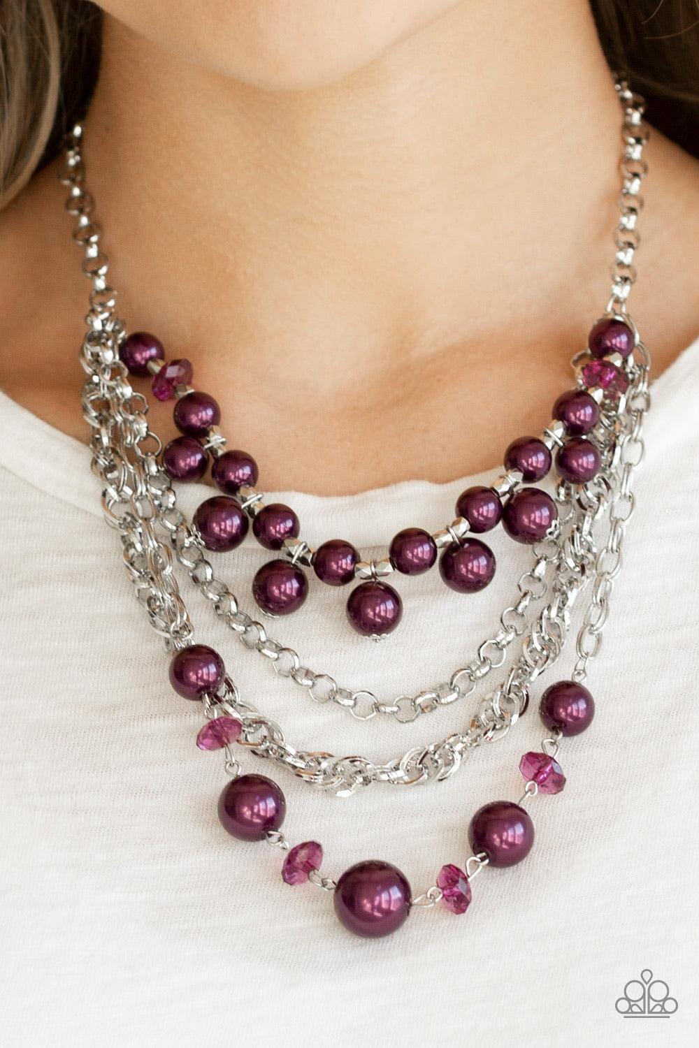 Paparazzi Accessories Rockin Rockette - Purple Varying in size, purple pearls, purple crystal-like beads, and faceted silver beads join with mismatched silver chains below the collar, creating a radically refined fringe. Features an adjustable clasp closu