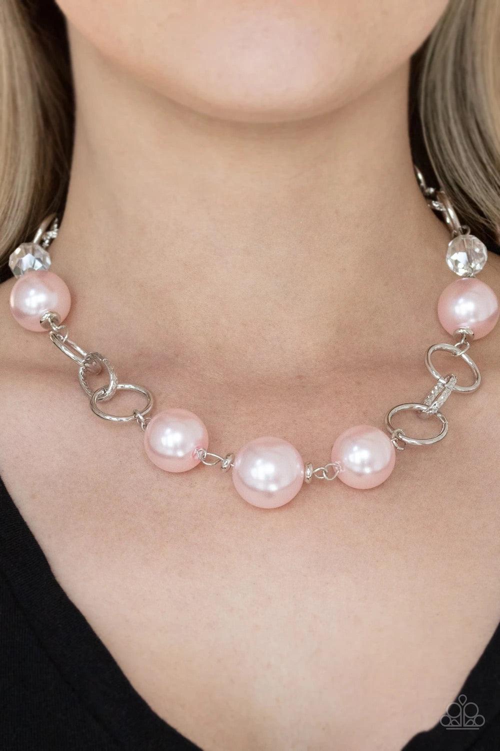 Paparazzi Accessories New Age Novelty - Pink Sections of bold silver links, oversized pink pearls, and glassy crystal-like beads haphazardly connect below the collar, creating a dramatic display. Features an adjustable clasp closure. Sold as one individua