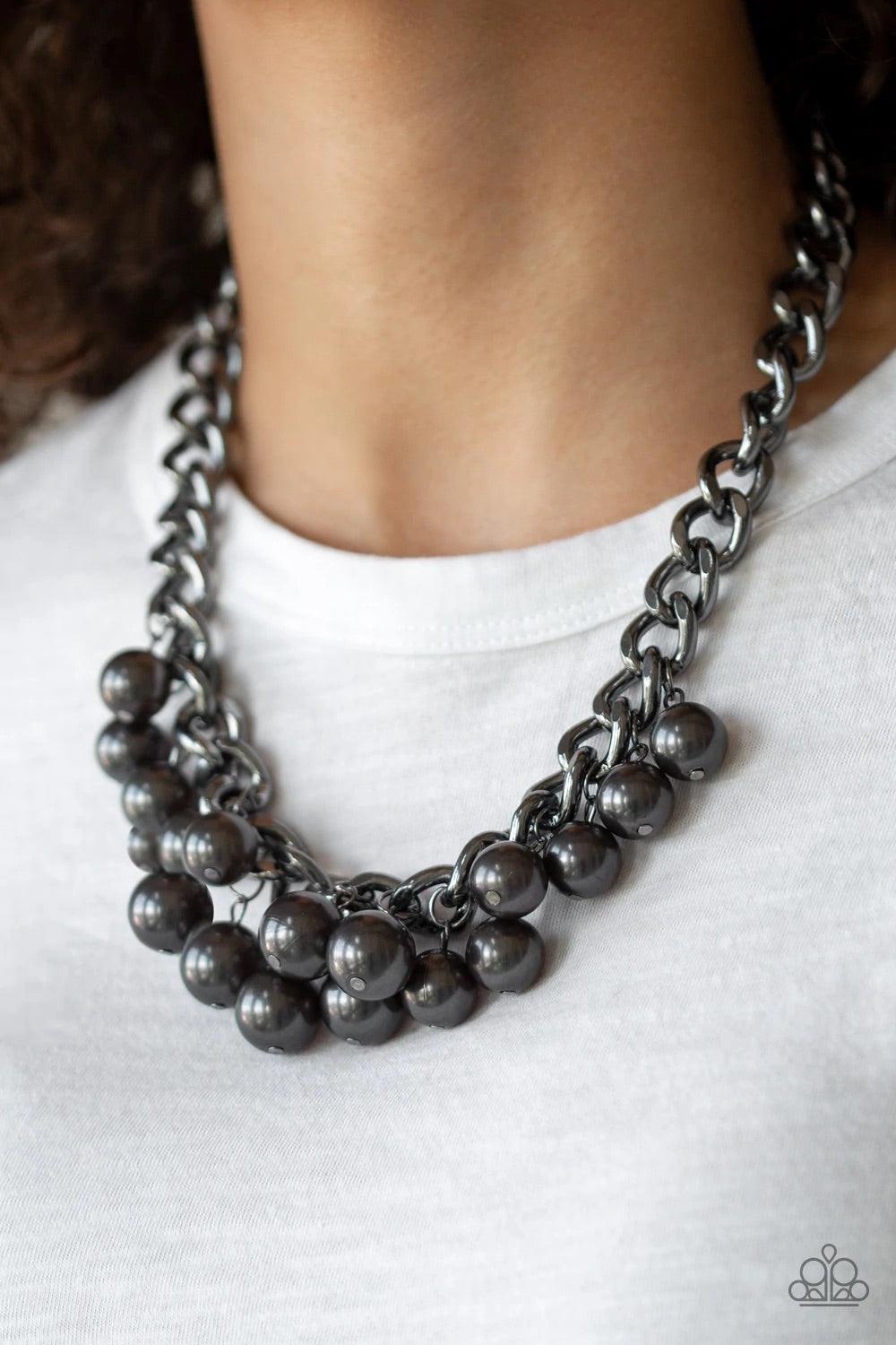 Paparazzi Accessories Get Off My Runway - Black Pearly gunmetal beads swing from the bottom of a hefty gunmetal chain, creating a dramatic fringe below the collar. Features an adjustable clasp closure. Sold as one individual necklace. Includes one pair of