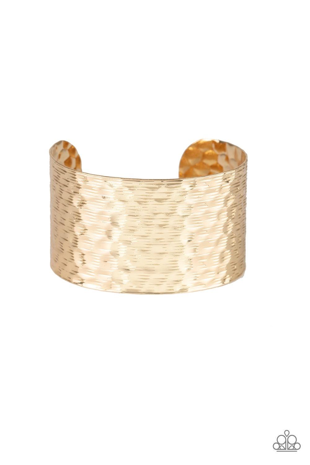 Paparazzi Accessories Simmering Shimmer - Gold Delicately scratched and hammered in endless shimmer, a thick gold cuff wraps around the wrist for a bold industrial flair. Jewelry