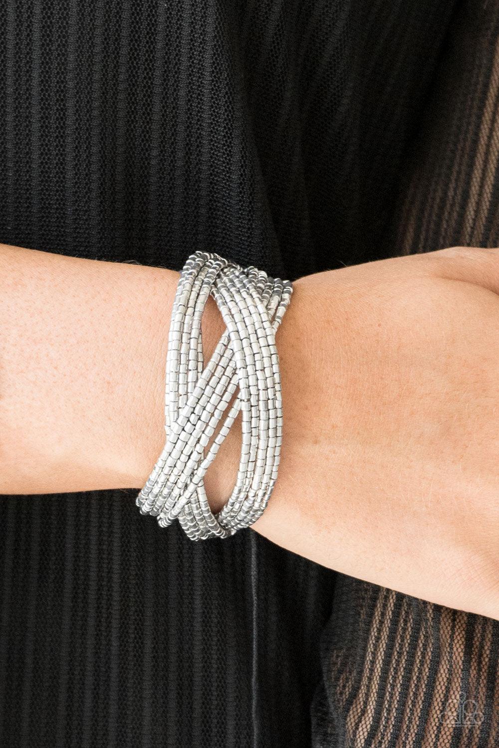 Paparazzi Accessories Shooting Stars - Silver Layers of silver seed beads are braided together to create a breathtaking cuff design that shimmers brilliantly along the wrist. Sold as one individual bracelet. Jewelry