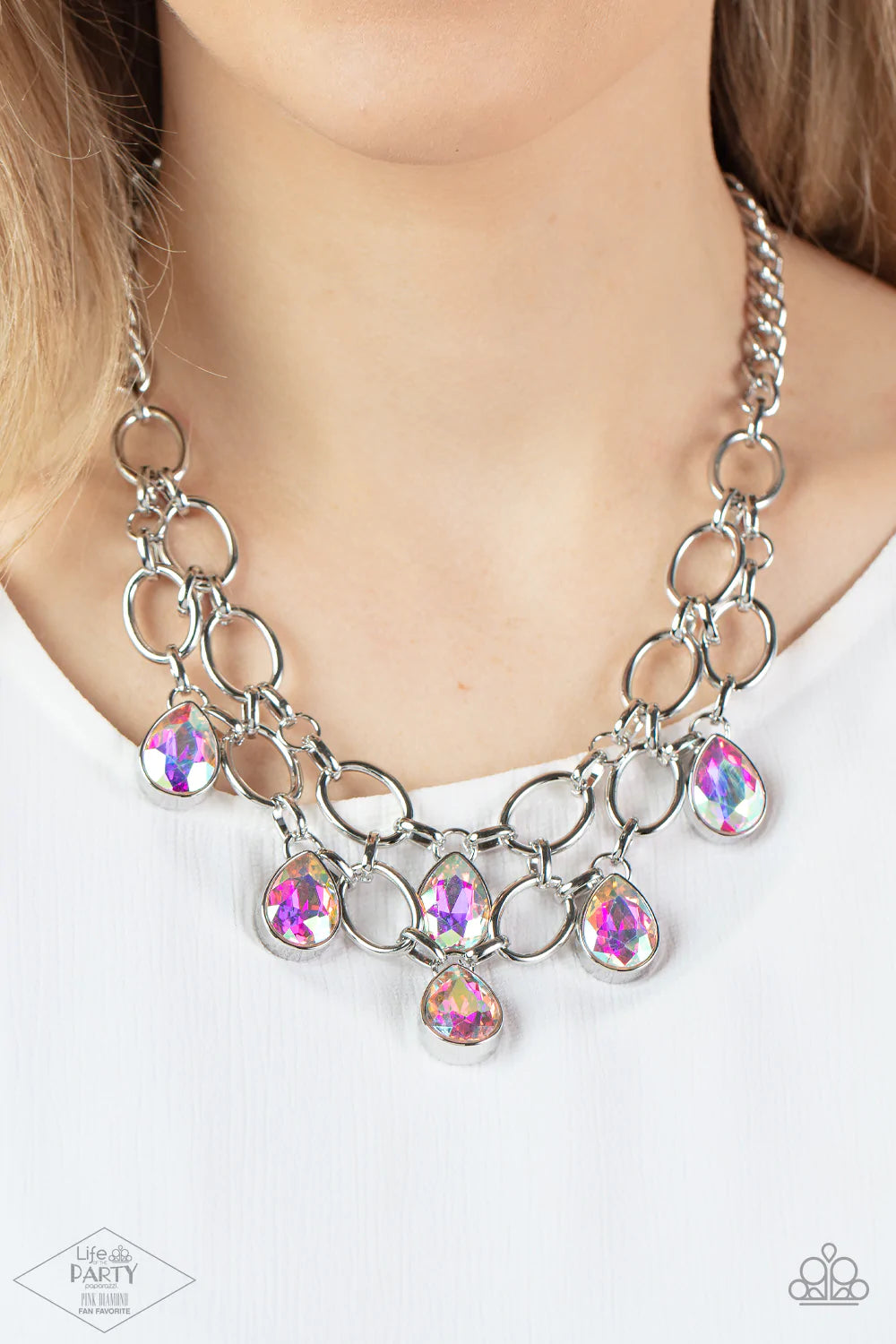 Paparazzi Accessories Show-Stopping Shimmer - Multi 1 Joined by dainty silver links, two rows of dramatic silver chain layer below the collar in a fierce fashion. Iridescent teardrop gems drip from the glistening layers, adding a timeless shimmer to the s