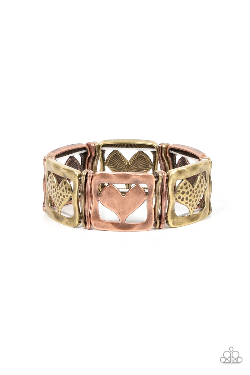 Paparazzi Accessories Legendary Lovers - Multi Encased in hammered frames, hammered copper hearts and brass hearts featuring a hammered dotted motif join pairs of wavy brass and copper frames along stretchy bands around the wrist for a romantic flair. Sol