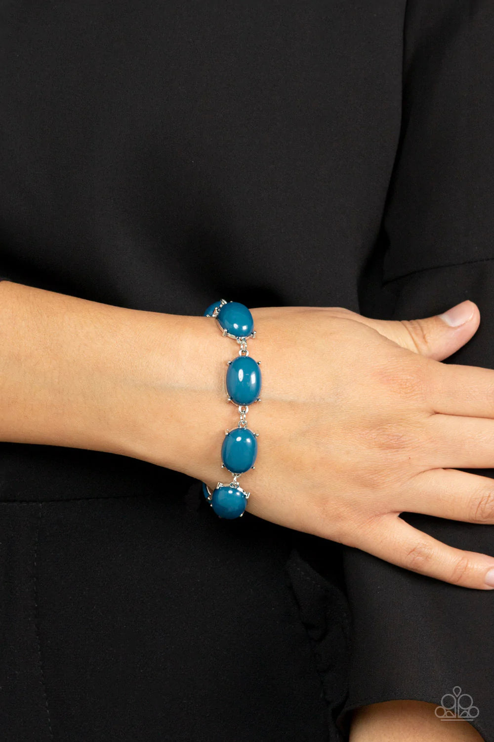 Paparazzi Accessories Confidently Colorful - Blue Featuring pronged silver fittings, an oversized collection of oval Mykonos Blue beads delicately link around the wrist for a dramatic pop of color. Features an adjustable clasp closure. Sold as one individ