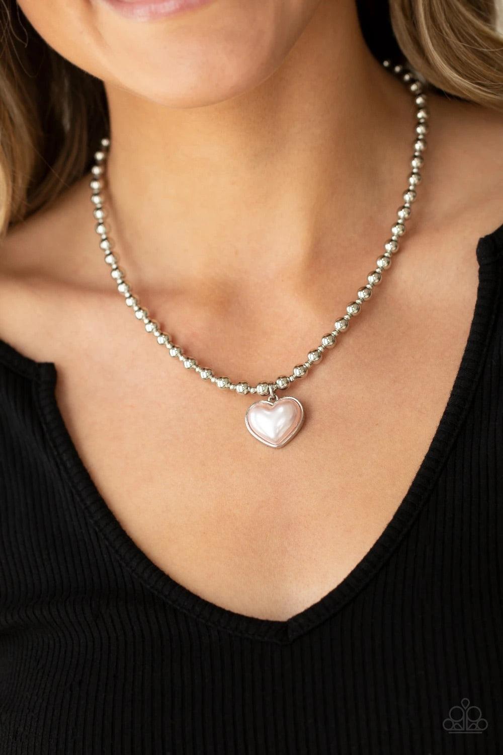 Paparazzi Accessories Heart Full of Fancy - Pink Featuring a pearly pink center, a charming heart pendant suspends from a strand of silver beads below the collar for a romantic flair. Features an adjustable clasp closure. Sold as one individual necklace.