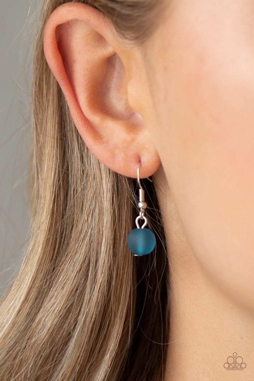 Paparazzi Accessories Arctic Art - Blue Featuring round and imperfectly flat shapes, an icy compilation of opaque Mosaic Blue beads are threaded along invisible wires, creating colorfully glassy layers below the collar. Features an adjustable clasp closur