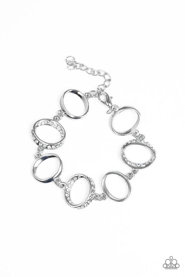 Paparazzi Accessories Beautiful Inside and Out - White Glistening silver hoops link with white rhinestone encrusted hoops around the wrist for a timeless shine. Features an adjustable clasp closure. Jewelry