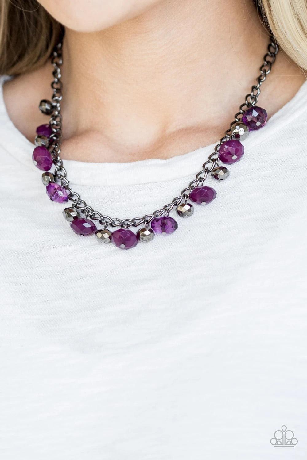 Paparazzi Accessories Runway Rebel - Purple Featuring cloudy and glassy finishes, faceted purple crystal-like beads swing from the bottom of a glistening gunmetal chain. Faceted gunmetal beads join the purple beading, creating a flirtatious fringe below t