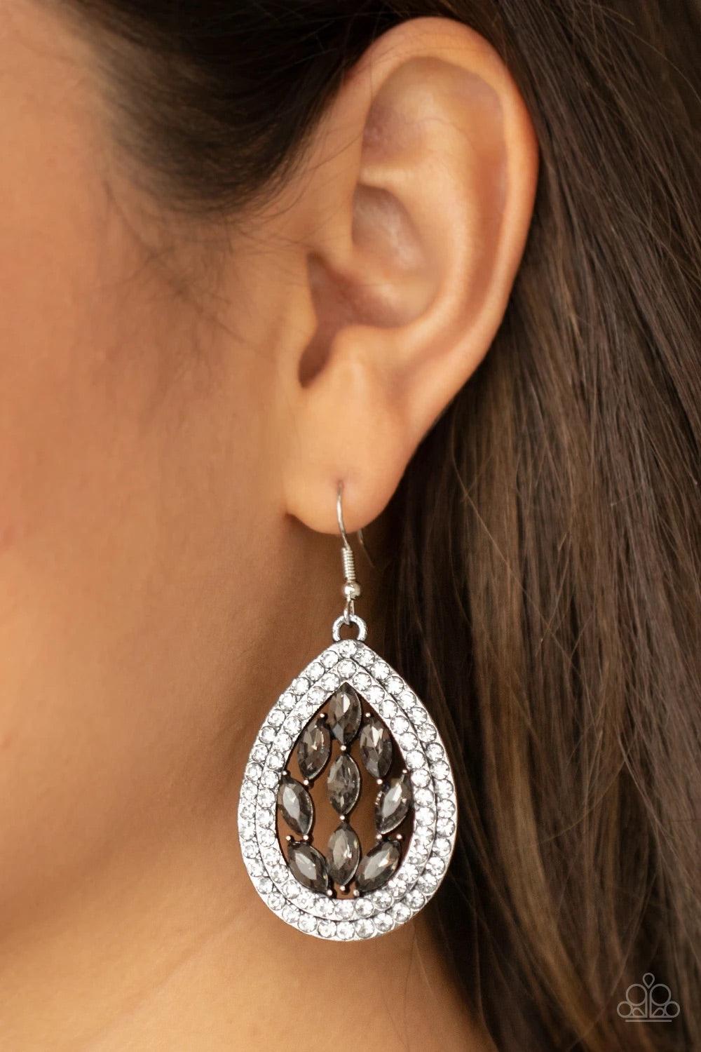 Paparazzi Accessories Encased Elegance - Silver Smoky marquise cut rhinestones collect inside two borders of glassy white rhinestones, coalescing into a sparkly teardrop. Earring attaches to a standard fishhook fitting. Sold as one pair of earrings. Jewel