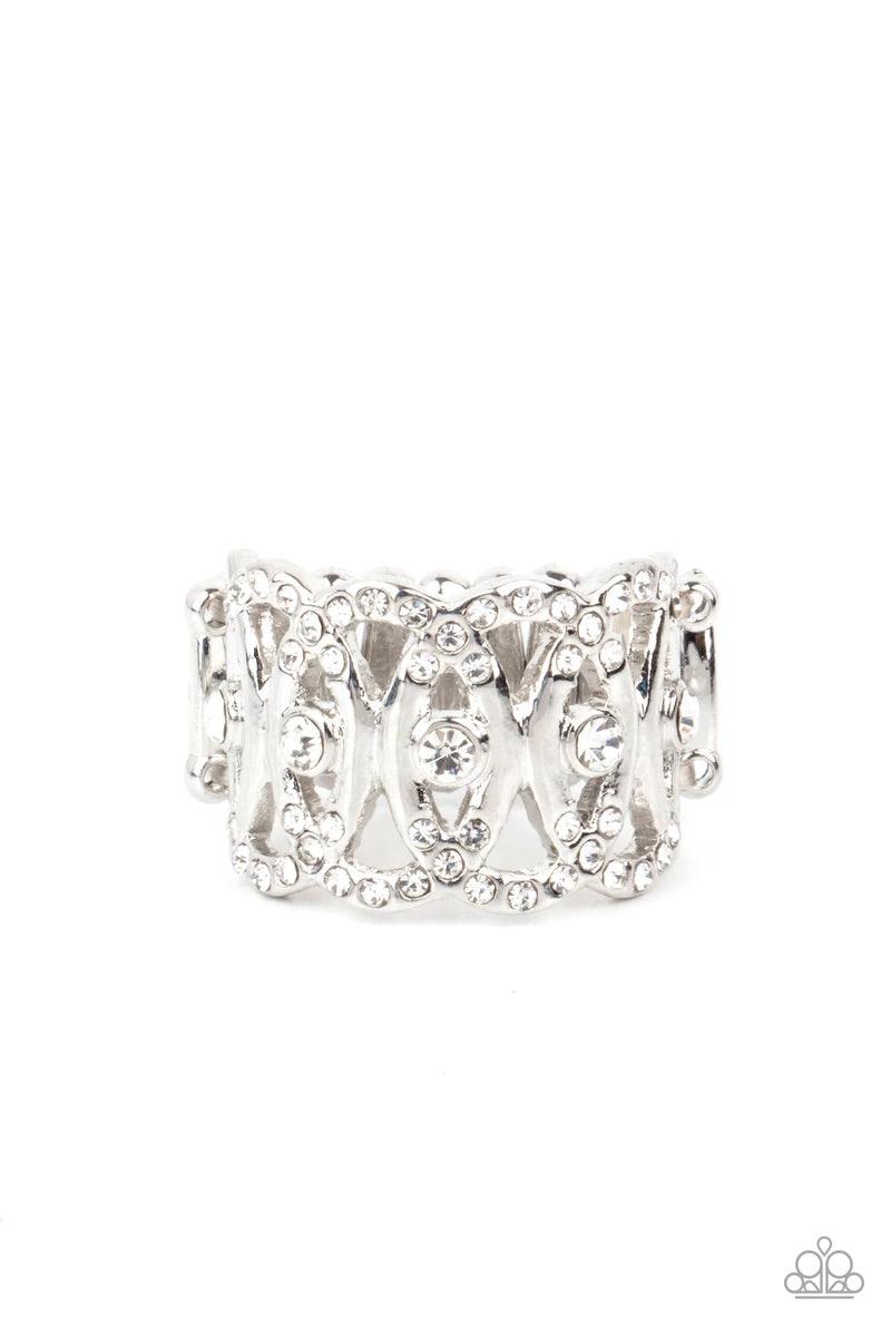 Paparazzi Accessories OVAL-Ruled - White Delicately overlapping across the finger, the tops and bottoms of silver ovals are encrusted in dainty white rhinestones. A row of solitaire white rhinestones adorns the center, creating a regal centerpiece. Featur