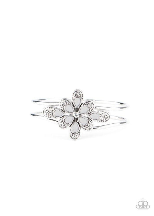 Paparazzi Accessories Go With The FLORALS - Silver A collection of decorative silver petals topped with gray accents fans out around a dainty white rhinestone center, creating a whimsical floral frame that sits atop an airy silver cuff. Features a hinged