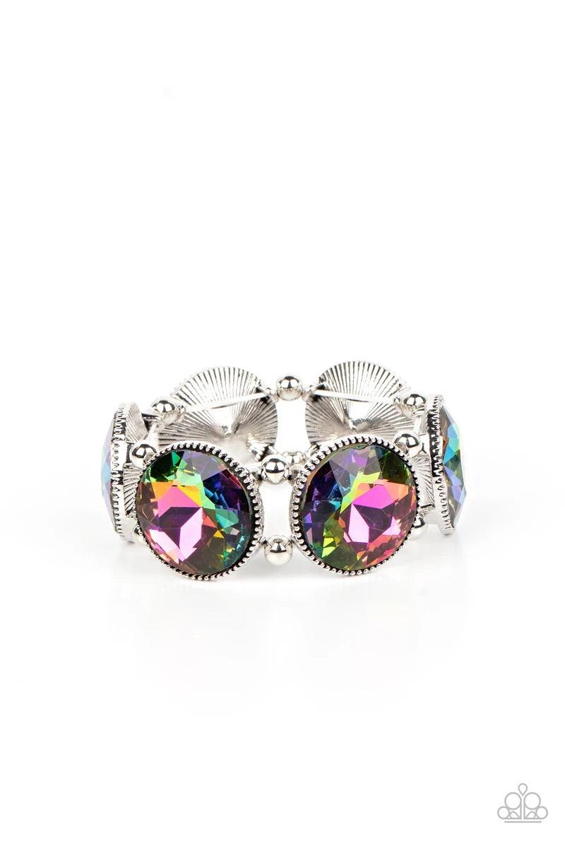Paparazzi Accessories Powerhouse Hustle - Multi Infused with pairs of silver beads, a glitzy collection of dramatically oversized oil spill rhinestone frames are threaded along stretchy bands around the wrist for a jaw-dropping dazzle. Sold as one individ