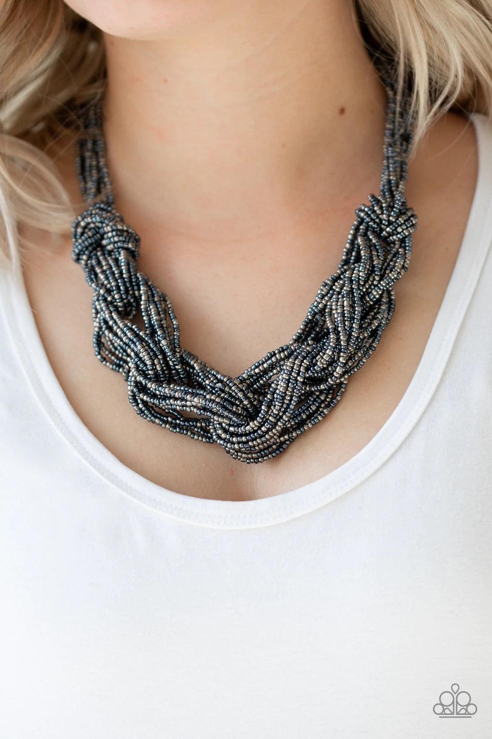 Paparazzi Accessories City Catwalk - Blue Brushed in a flashy metallic finish, countless strands of blue and gunmetal seed beads weave into a bulky square braid below the collar for a glamorous look. Features an adjustable clasp closure. Sold as one indiv