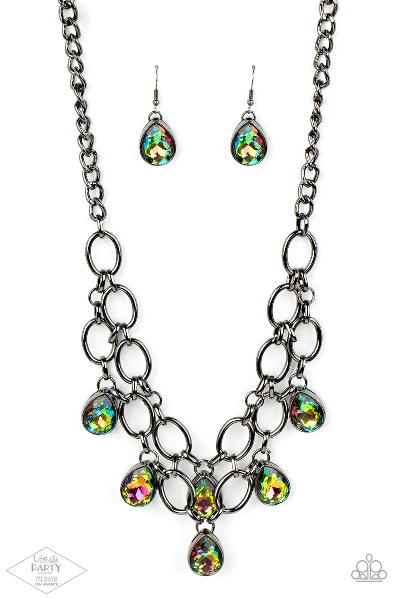 Paparazzi Accessories Show-Stopping Shimmer - Multi 2 Joined by dainty gunmetal links, two rows of dramatic gunmetal chain layer below the collar in a fierce fashion. Oil spill teardrop gems drip from the glistening layers, adding a timeless shimmer to th