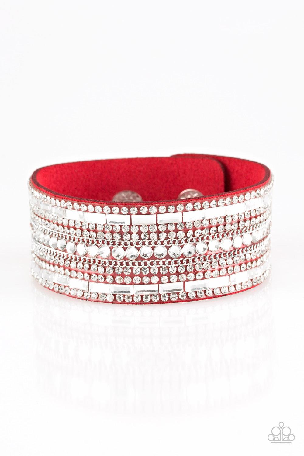 Paparazzi Accessories Rebel Radiance - Red Featuring classic round and edgy emerald style cuts, glittery white rhinestones and glistening silver chains are encrusted along bands of red suede for a sassy look. Features an adjustable snap closure. Sold as o