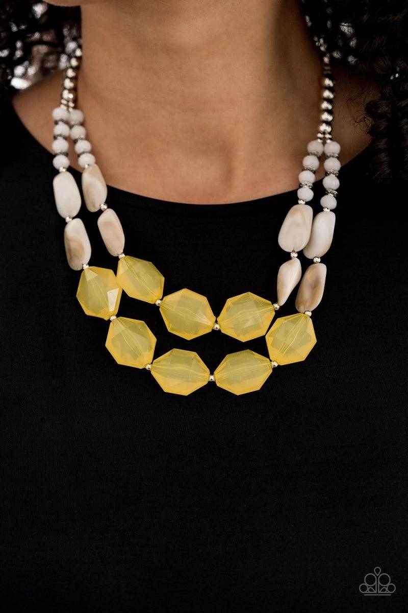 Paparazzi Accessories Seacoast Sunset - Yellow A whimsical collection of silver, opaque crystal-like, cloudy white, and faceted yellow beads are threaded along invisible wires, creating statement-making layers below the collar. Features an adjustable clas