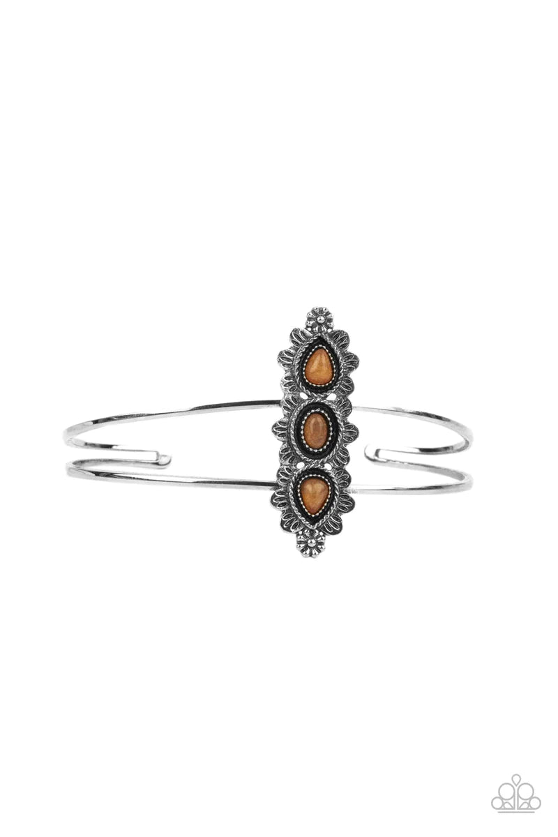 Paparazzi Accessories Fairytale Flowerbeds - Orange Infused with glassy orange stone centers, silver flowery frames stack across the center of an airy silver cuff for an enchanted fashion. Sold as one individual bracelet. Bracelets
