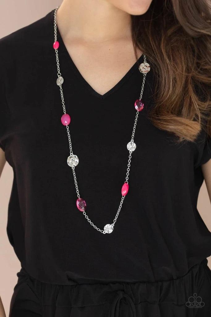 Paparazzi Accessories Glossy Glamorous - Pink Featuring glassy, polished, and opaque finishes, a faceted collection of pink beads join hammered silver discs along a shiny silver chain, creating a colorful display across the chest. Features an adjustable c