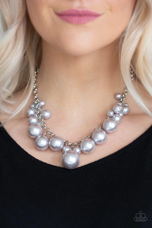 Paparazzi Accessories Broadway Belle - Silver Capped in shiny silver fittings, over-sized pearly gray beads and a collection of classic gray pearls swing from the bottom of a shimmery silver chain, creating a bubbly fringe below the collar. Features an ad