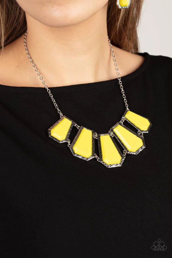 Paparazzi Accessories Stellar Heiress - Yellow Encased in hammered silver fittings, trapezoidal Illuminating acrylic frames delicately fan out below the collar for a dramatic pop of color. Features an adjustable clasp closure. Sold as one individual neckl