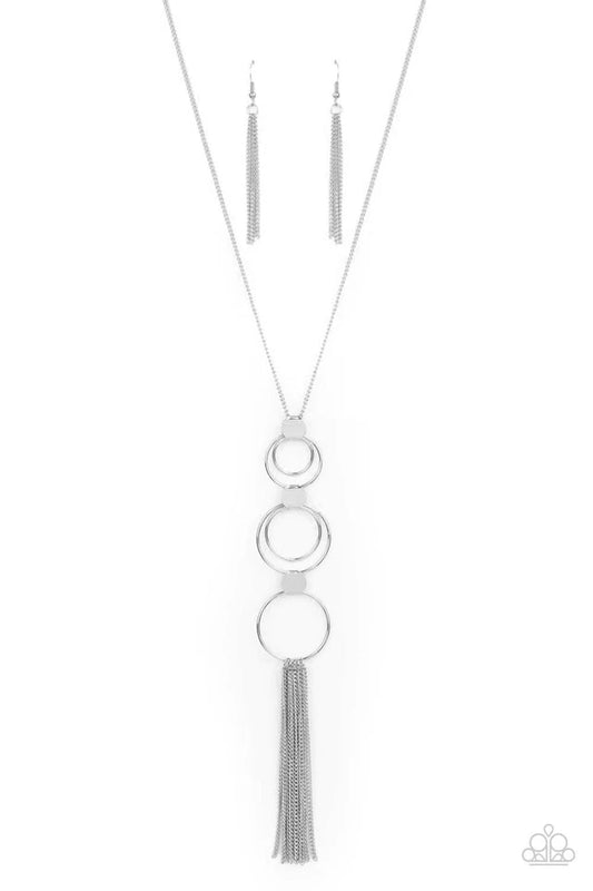 Paparazzi Accessories Join The Circle - Silver A set of concentric silver circles connected by flat silver discs swings from a lengthened silver chain. A soft silver fringe sways from the bottom ring for an elemental approach. Features an adjustable clasp