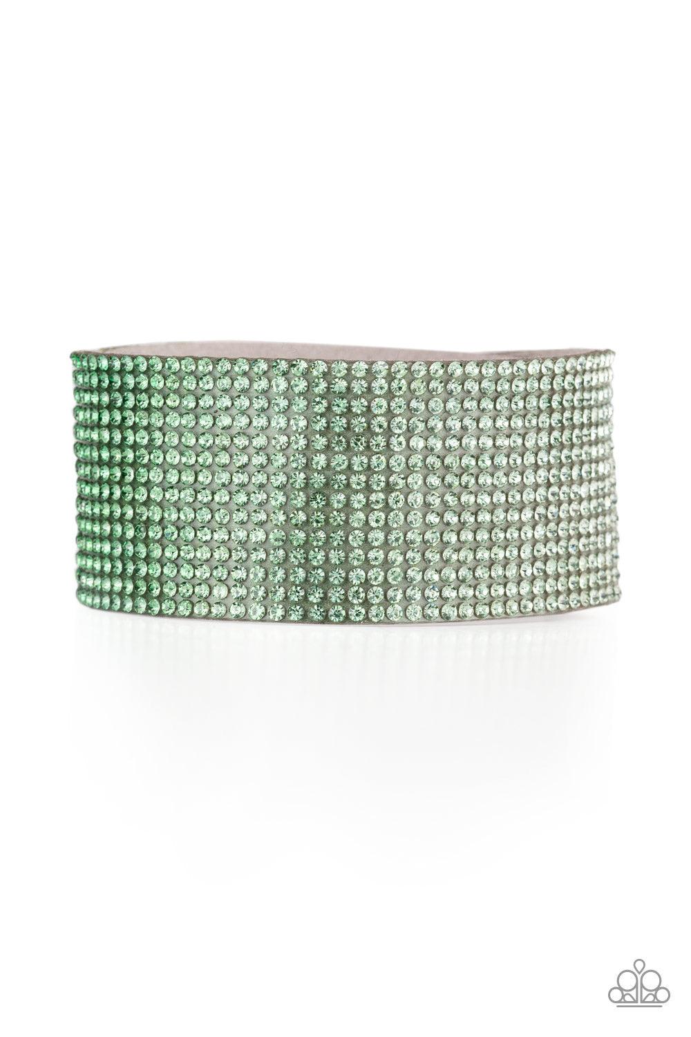 Paparazzi Accessories Fade Out - Green Row after row of glassy rhinestones gradually fade from light green to dark green across the front of a thick gray suede band for a trendy ombre look. Features an adjustable snap closure. Jewelry