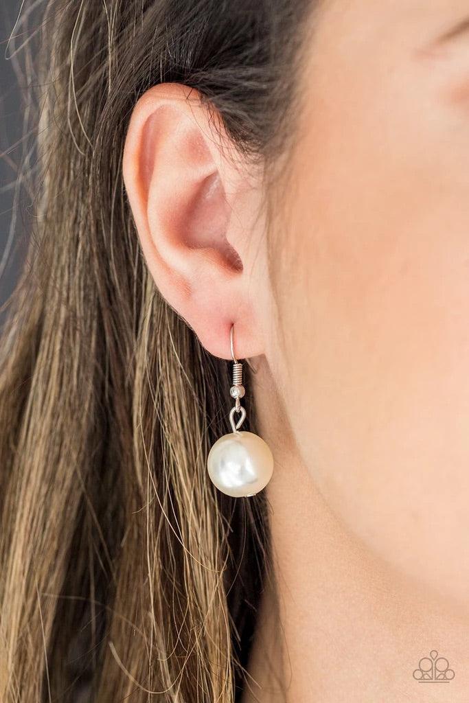Paparazzi Accessories Take Note - White A collection of oversized silver and pearly white beads drape across the chest for a refined look. Features an adjustable clasp closure. Sold as one individual necklace. Includes one pair of matching earrings. Jewel