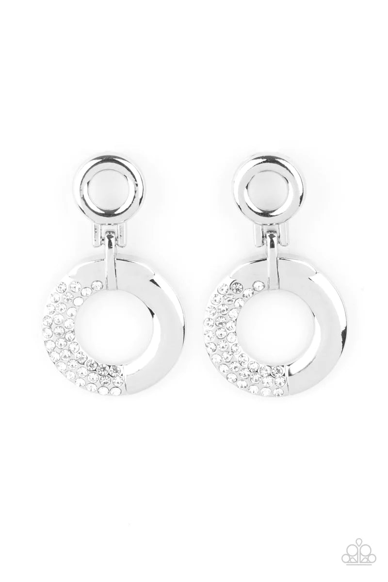 Paparazzi Accessories Modern Motivation - White A dainty silver hoop attaches to a shimmery silver ring that is half dipped in glassy white rhinestones, creating a modern look. Earring attaches to a standard post fitting. Sold as one pair of post earrings