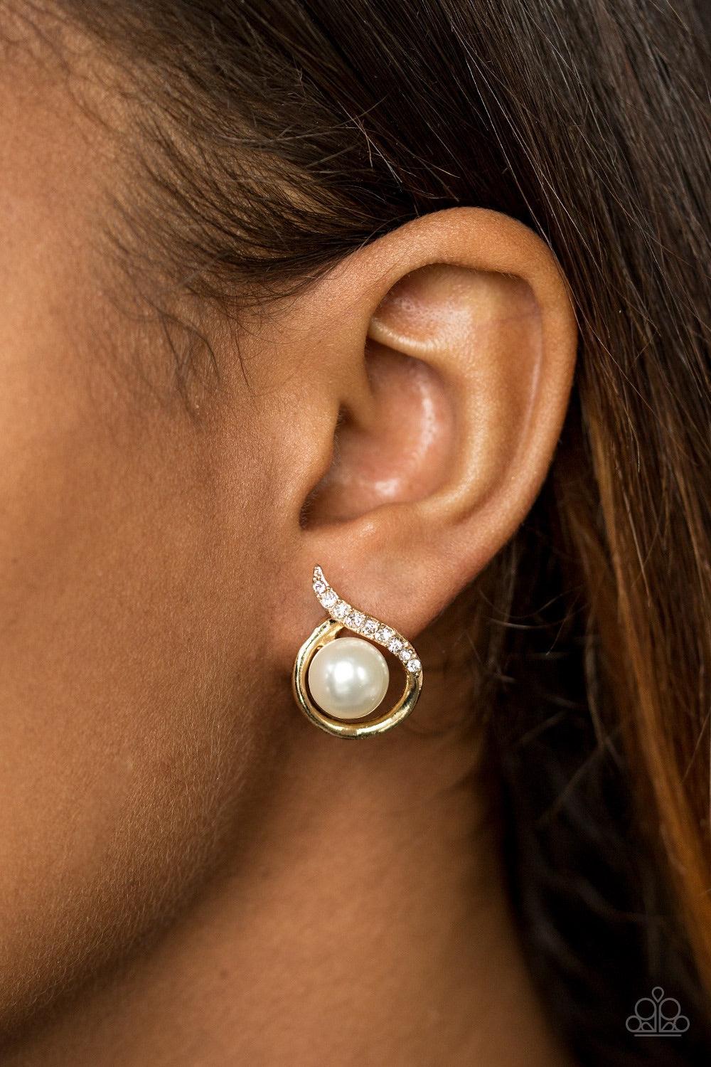 Paparazzi Accessories Ballroom Beauty - Gold Encrusted in a section of glassy white rhinestones, a shimmery ribbon of gold circles around a pearly white bead for a refined look. Earring attaches to a standard post fitting. Jewelry