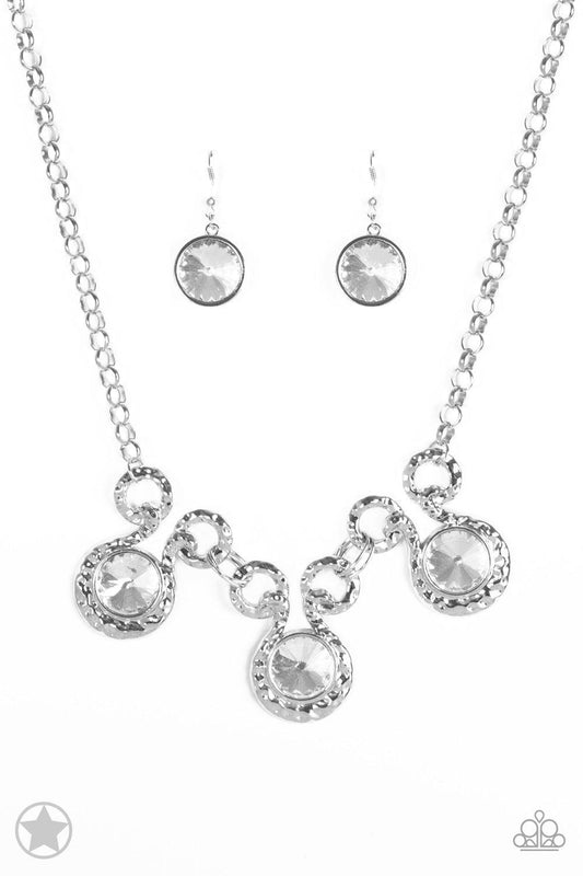 Paparazzi Accessories Hypnotized - Silver Three dramatically oversized rhinestones are nestled into three textured silver fittings that are connected by oval silver rings, creating a brilliant statement piece. Features an adjustable clasp closure. Jewelry