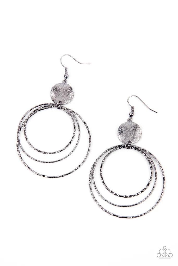 Paparazzi Accessories Universal Rehearsal ~Black A shimmery wavy gunmetal disc links atop a collection of three delicately hammered gunmetal rings in concentric sizes for an out-of-this-world finish. Earring attaches to a standard fishhook fitting. Sold a